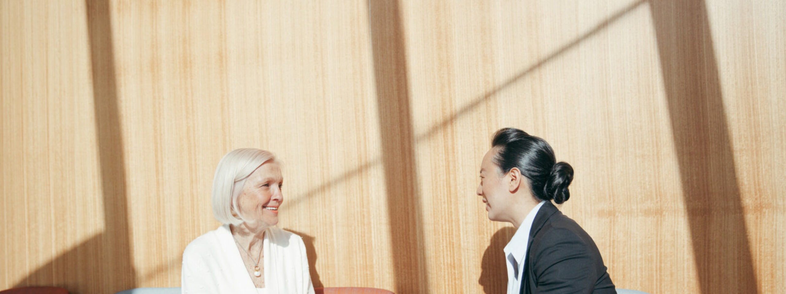 Mature women and Jones Radiology female representative discuss 3D mammography at Alice Springs